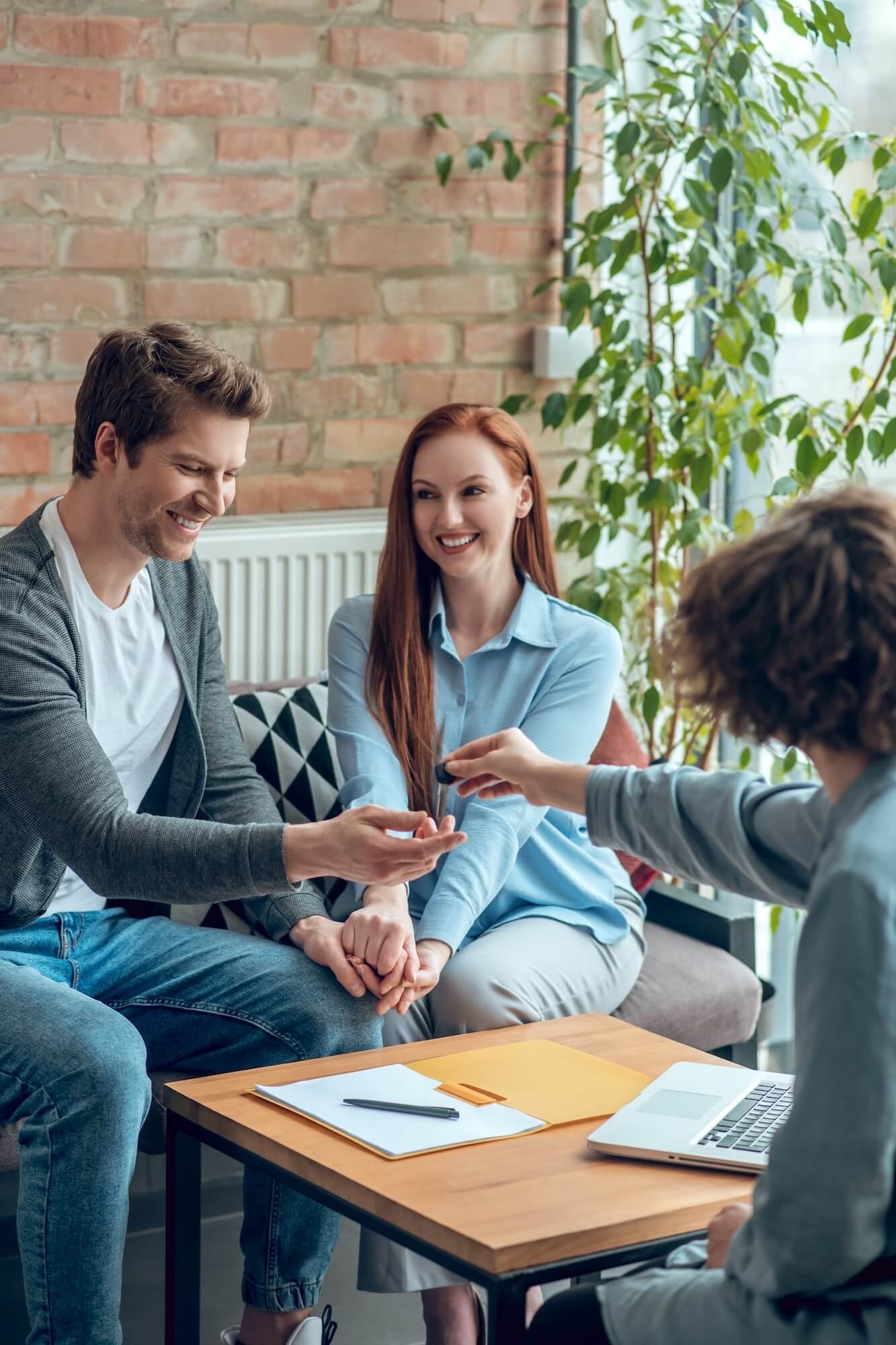 broker-giving-buyer-real-estate-key-1-1.jpg